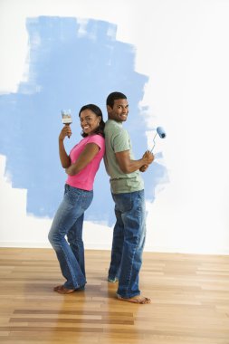 Couple portrait with paint supplies. clipart