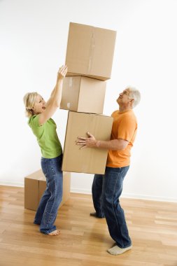 Woman stacking boxes. clipart