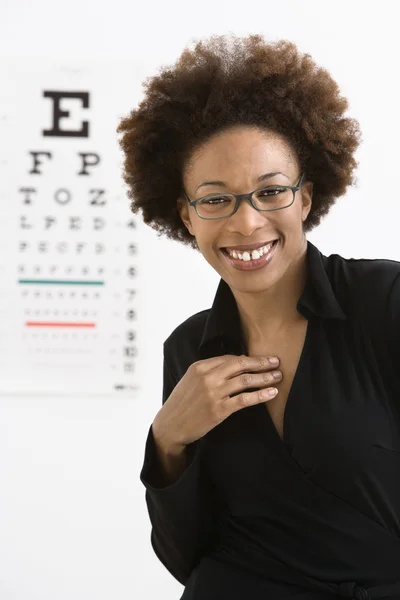 Woman with eye chart — Stock Photo, Image