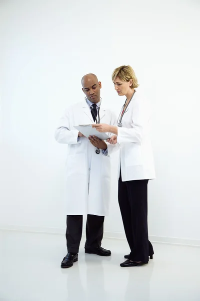 Doctors with chart. — Stock Photo, Image