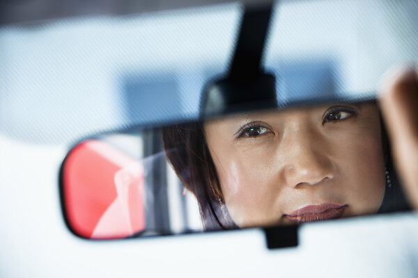 Woman in rearview mirror