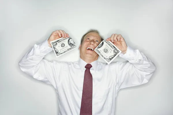 Uomo d'affari sprecare denaro — Foto Stock