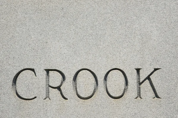 Word "crook" on gravestone. — Stock Photo, Image