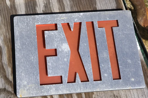 Exit sign on wood — Stock Photo, Image