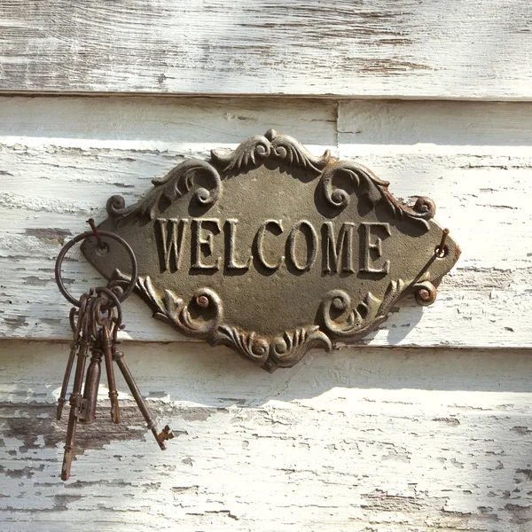 Welcome sign on wall. — Stock Photo, Image