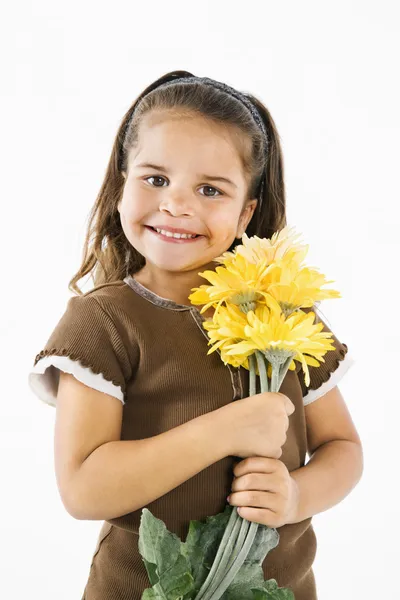 stock image Little smiling hispanic girl with flowers.