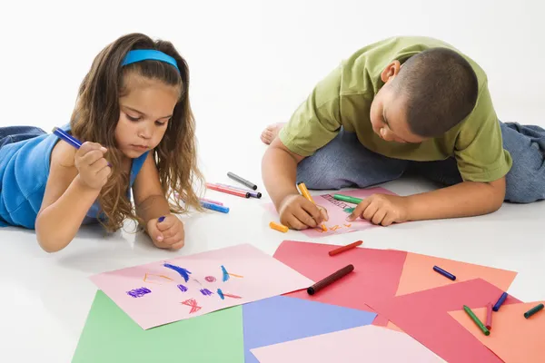Hispanic boy and girl coloring. — Stock Fotó
