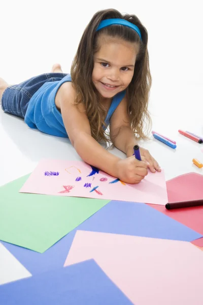 Smiling hispanic girl coloring. — Stock Photo, Image