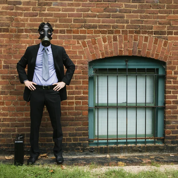 Businessman wearing gas mask. — Stock Photo, Image