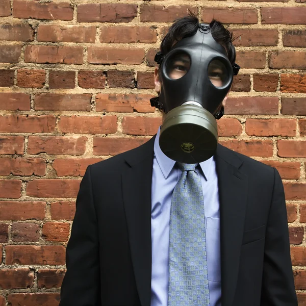 Businessman wearing gas mask. — Stock Photo, Image