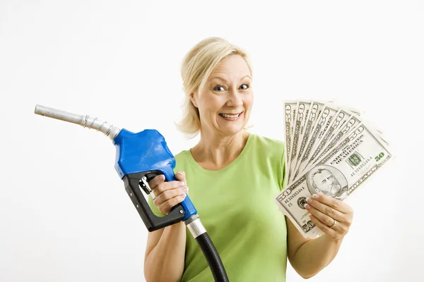 Mujer feliz con bomba de gasolina y dinero . —  Fotos de Stock