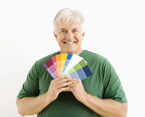 Człowiek z próbki farby. — Zdjęcie stockowe