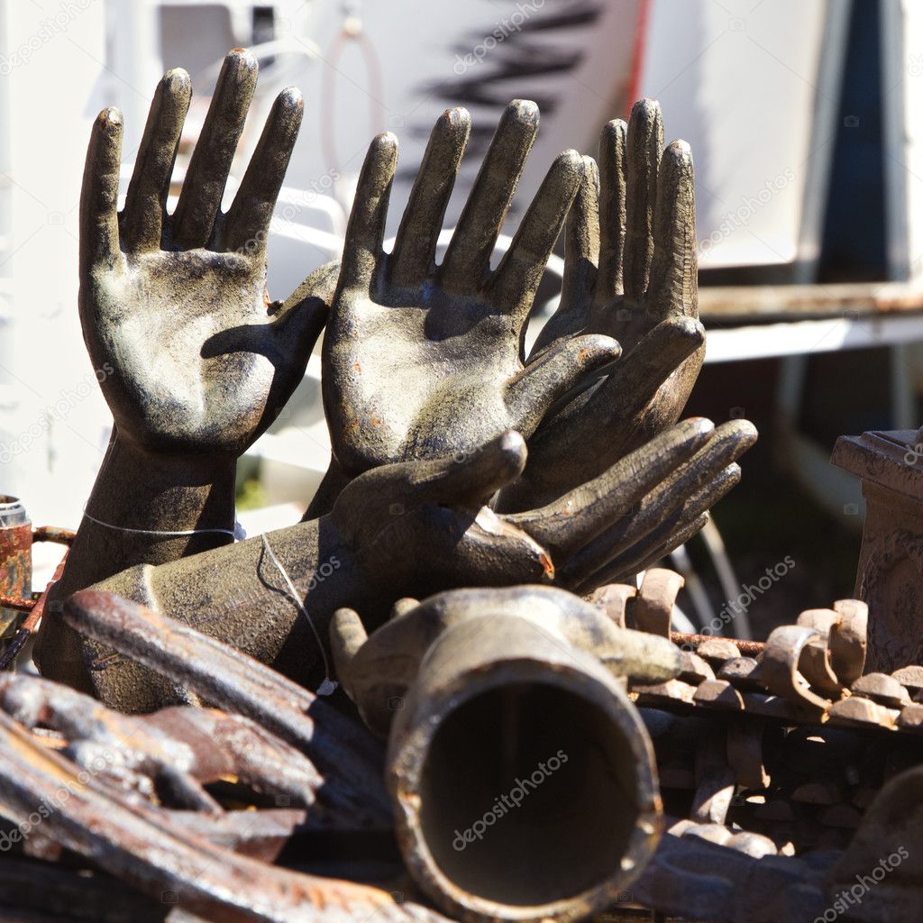 Old metal hand statuettes.