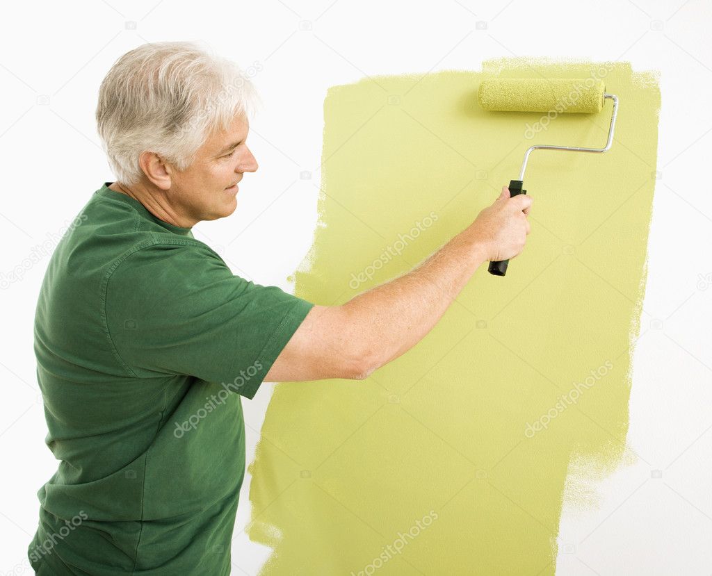 Man painting wall.
