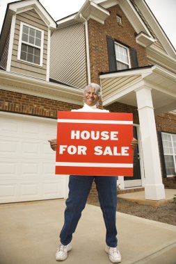 Woman with house. clipart