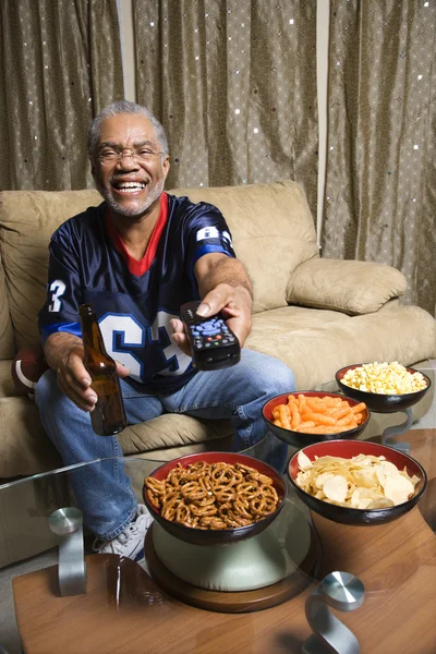 Man with remote control. — Stock Photo, Image