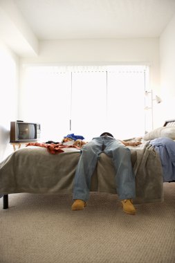 Man Lying on Bed clipart