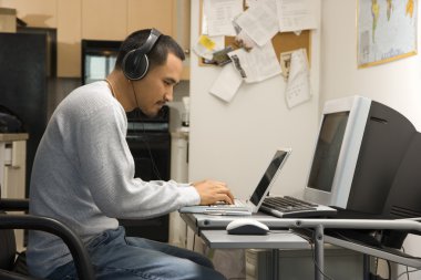 Man on computer. clipart