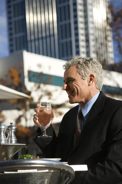 Businessman at outdoor cafe. — Stock Photo, Image