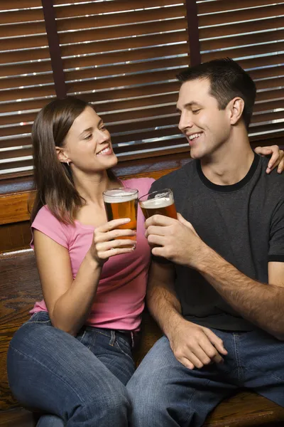 Couple Toasting Their Beers — Stock Photo, Image