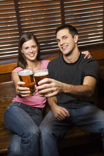 Couple Toasting Their Beers — Stock Photo, Image