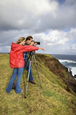 Couple taking pictures. clipart