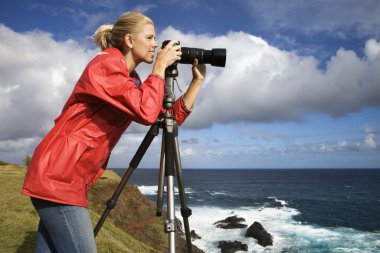 Woman taking pictures. clipart