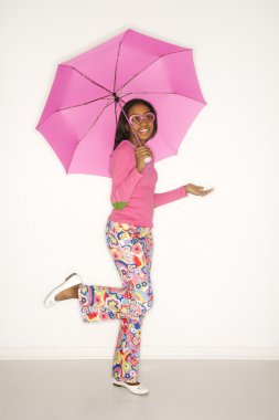 Girl holding umbrella. clipart