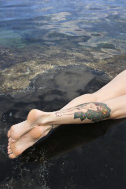 Tattooed legs. clipart