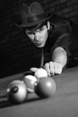 Retro male shooting billiards. clipart