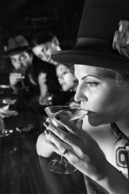 Retro woman drinking martini. clipart