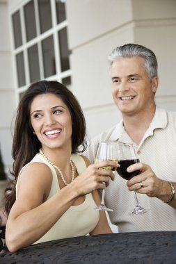 Couple toasting with wine. clipart