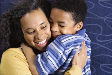 Woman Hugging Son clipart