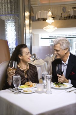 Couple dining in nice restaurant. clipart