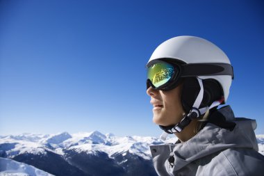 Boy snowboarder in mountains. clipart