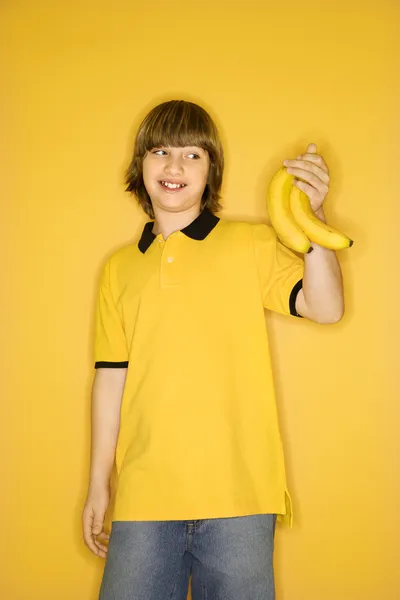 Boy holding bananas. — Stock Photo, Image