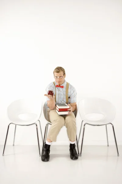 Estudante com livros e maçã . — Fotografia de Stock