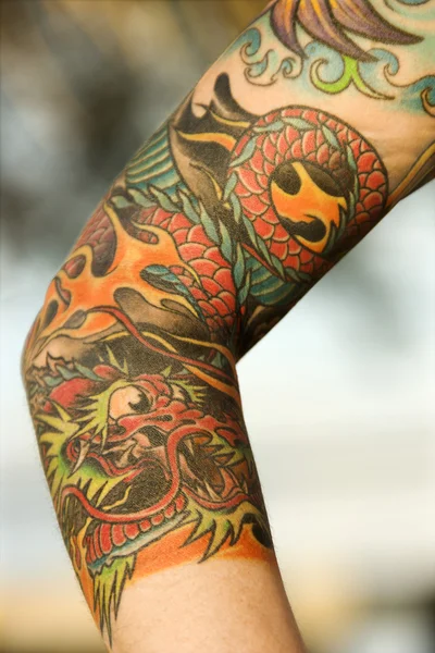 Tattooed arm. — Stock Photo, Image