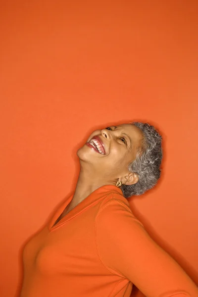 Woman with head back smiling. — Stock Photo, Image