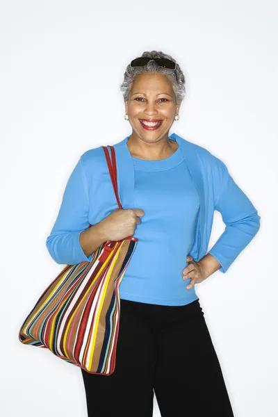 Woman holding big purse. — Stock Photo, Image