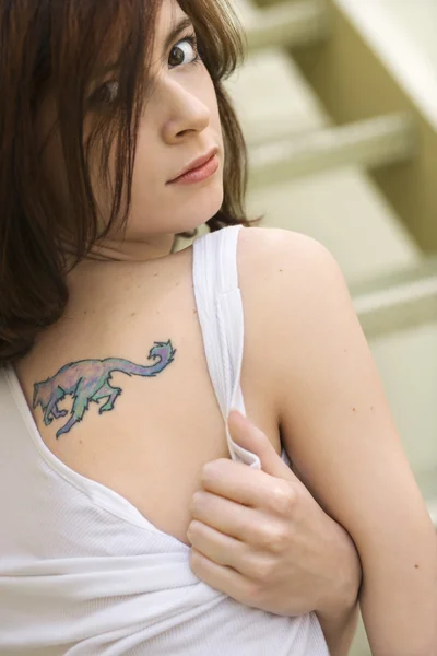 Young woman with tattoo. — Stock Photo, Image