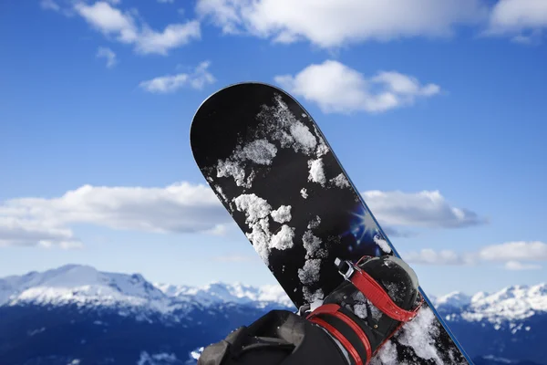 Snowboard and mountain. — Stock Photo, Image