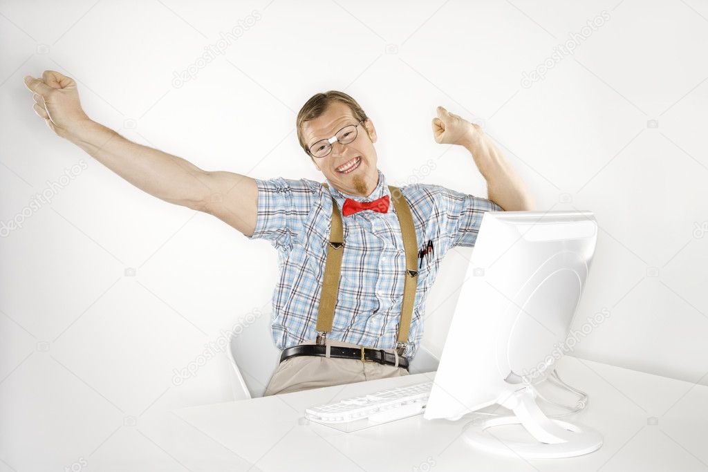 Smiling man with computer.