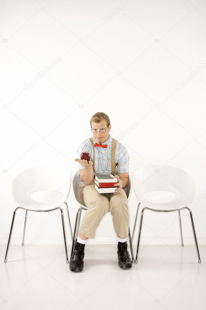 Student with books and apple.