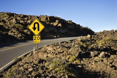 Curvy road and sign. clipart