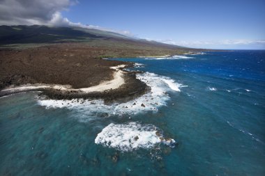 Coast with lava rocks. clipart