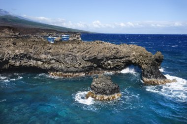 Rocky cliff on ocean. clipart