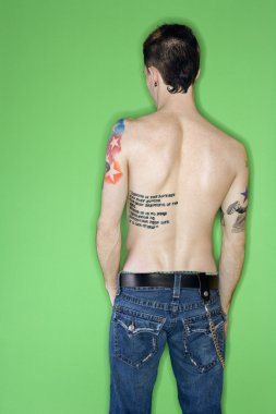 Man's back with tattoos. clipart