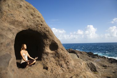 Woman meditating. clipart