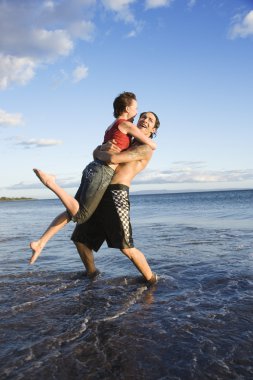 Romantic couple on beach. clipart